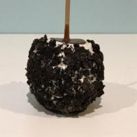 Caramel apple with Oreo · Caramel apple dipped in white chocolate and rolled with Oreo cookie crumbs.