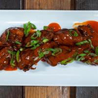Wings: Buffalo (6 Pieces) · Parbaked, finished in the fryer, topped with our house buffalo sauce. 6 piece chicken come w...