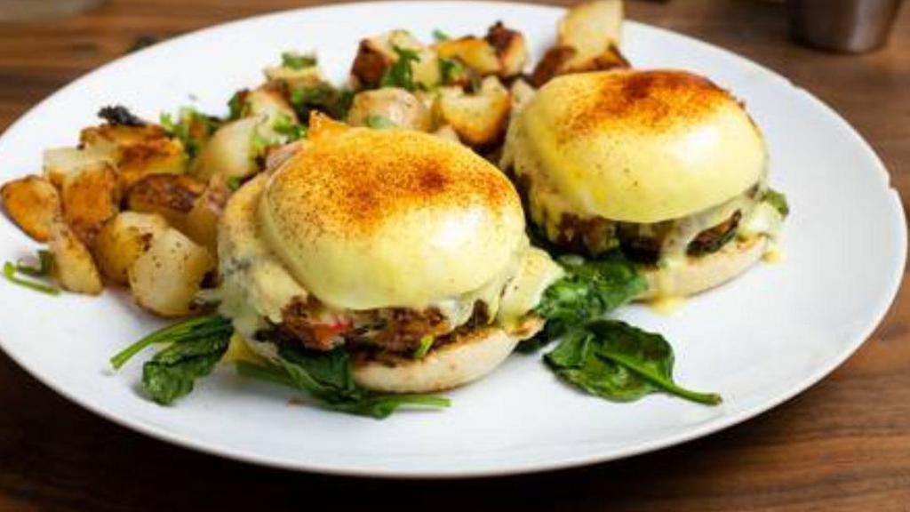 Crab Cake Florentine · 2 poached eggs, spinach, crab cake on an English muffin, topped with hollandaise sauce, and served with potatoes or fruit or salad.