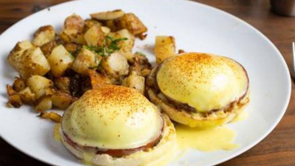 Eggs Benedict  · 2 poached eggs, Canadian bacon on an English muffin, topped with hollandaise sauce, and served with potatoes or fruit or salad.