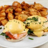 Salmon Benedict Breakfast · 2 poached eggs, salmon, tomato, served on an English muffin, topped with hollandaise sauce, ...