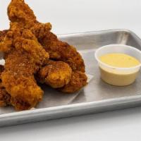 Cajun Chicken · cajun spiced chicken tender served with a side of remoulade