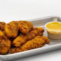 Indian Curry Spiced Chicken · curry spiced chicken tender served with a side of butter chicken yogurt sauce