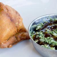 Samosa (1) · A single crunchy savory pastry stuffed with spicy potatoes and peas. Served with zingy cilan...