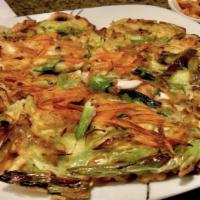 4.  Hae Mul Pa Jeon · Korean assorted seafood pancake 
(Seafood: baby shrimps, muscles, calamari)