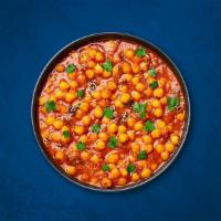Chickpea Supreme (Vegan) · Chickpeas, slow-cooked till soft in an onion and tomato curry with Indian whole spices. Serv...