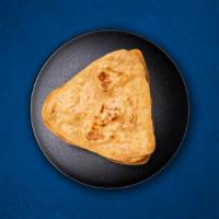 Plain Paratha (Vegan) · Whole wheat flaky bread baked over a flat griddle.