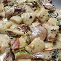 Gnocchi · morel mushrooms, spring peas, white corn, white truffle-porcini cream