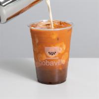 Thai Iced Tea · Sweetened classic thai tea served with evaporated milk - the way it's meant to be.
