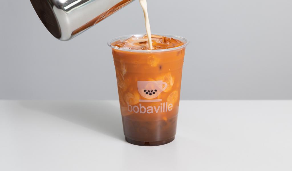 Thai Iced Tea · Sweetened classic thai tea served with evaporated milk - the way it's meant to be.