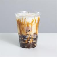 Boba + Milk · No caffeine. A cup of milk loaded with our handmade boba and caramelized black sugar syrup.
