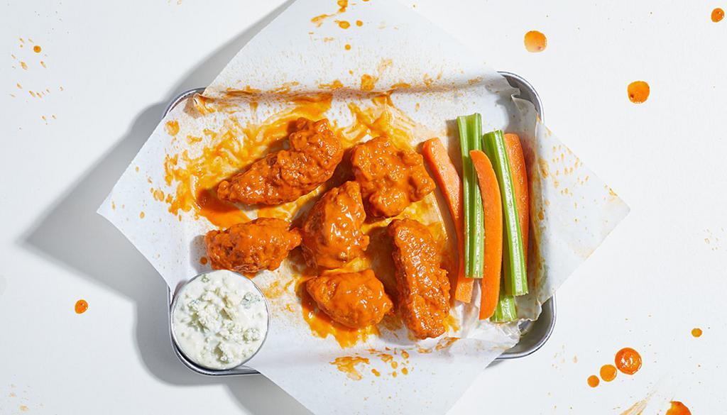 Boneless Chicken Wings (6) · 6 boneless wings with your choice of sauce. Served with celery or carrots, and blue cheese or ranch.