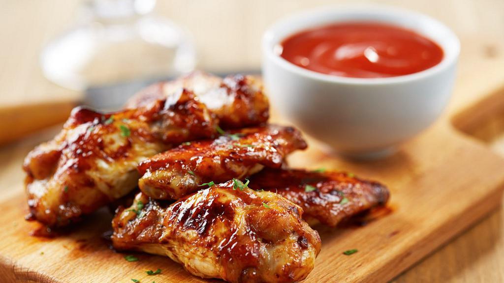 Sweet Chili Chicken Wings · Perfect combo of sweet and spicy in wing form. Served with a side of ranch dressing.