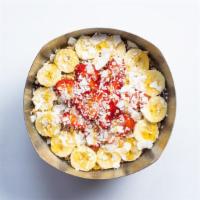 Tropical Bowl · Acai blended with apple juice, coconut milk, banana, mango, pineapple and flax seed. Topped ...
