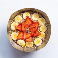 Breakfast Bowl · Acai blended with almond milk, flax seed, banana and strawberries. Topped with granola, bana...
