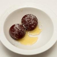 Gulab Jamun · Deep fried dough balls served in sugar syrup flavored with rose water.