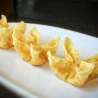 A8. Creamy Wonton (5) · Crisp wonton with cream cheese and caramelized onion; served with sweet tangy sauce.