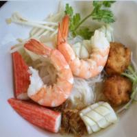 S14. Seafood Noodle Soup · Noodle topped with assorted seafood in a delicate flavored broth served with cilantro, scall...