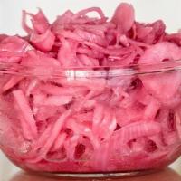 Pickled Onion Mojo · Our pink, pickled onions. Delicious garnish for our beans, salads or lechón.