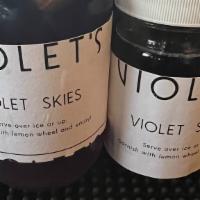Violet Skies · Butterfly pea flower mezcal, city of London gin, Ventura strawberry brandy, Rothman & Winter...