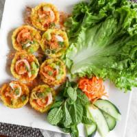 15.(Shrimp Mini Pancake) Banh Khot Tom · Sweet onion, bean sprout in pan seared rice flour with lettuce, mints, cucumber and house fi...