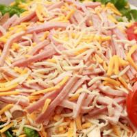 Chef Salad · Green leaf lettuce, ham, turkey, jack and cheddar cheese, carrots, red onions tomatoes and a...