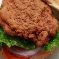 Crispy Chicken Burger · Breaded crispy chicken breast and cooked to a golden brown. Served on a brioche bun prepared...