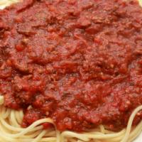 Spaghetti & Meatballs · Pasta noodles topped with our famous tomato meat sauce and two beef and pork meatballs.