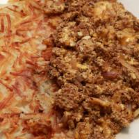 Chorizo Scramble · Spicy chorizo sausage scrambled with three eggs, red onions, cheddar cheese. Hashbrowns and ...