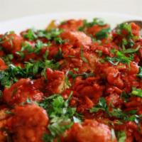 Chicken 65 · Deep-fried chicken tempered with curry leaves and green chilies & sauteed in hot red sauce.