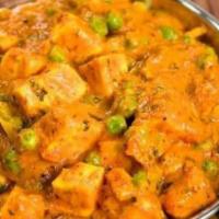 Mutter Paneer · Delicious dish made by cooking paneer & green peas in spicy onion tomato masala.