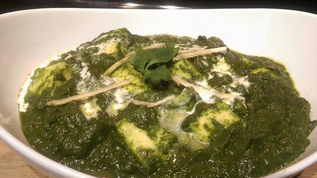 Palak Paneer · This dish is very smooth creamy palak paneer made with fresh spinach leaves, paneer, onions, herbs and spices.