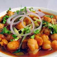Channa Masala · This dish is a delicious & flavorful Indian curry made by cooking chickpeas in a spicy onion...