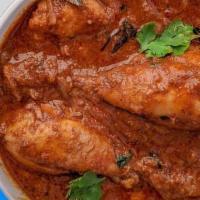 Chicken Curry · Cubes of succulent chicken cooked in a traditional brown gravy with herbs and spices.