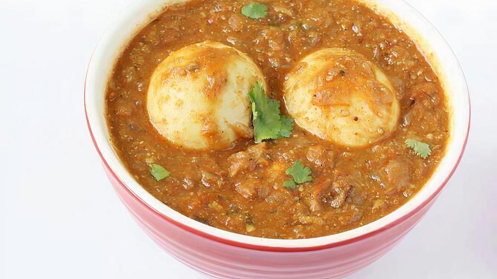 Egg Masala · Whole Boiled Eggs lightly tossed and fried with onions and green chillies in hint of herbs and spices.