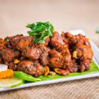 Mutton Pepper Fry · A spicy, toothsome, and savory dish made with fried minced mutton and zesty spices.