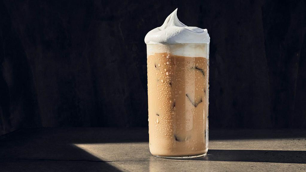 Iced Madagascar Vanilla Latte · 290 Cal. Freshly brewed espresso with foamed milk and Madagascar vanilla syrup, served over ice and topped with whipped cream. Allergens: Contains Milk