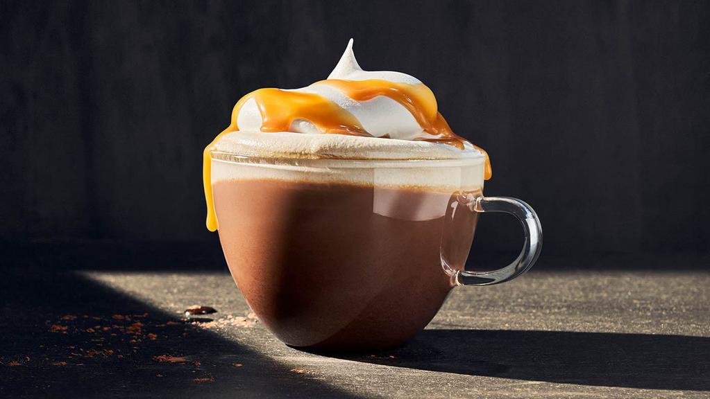 Hot Chocolate · Regular (430 Cal.), Large (550 Cal.) Bittersweet chocolate flavored syrup mixed with foamed milk and topped with whipped cream and drizzled with caramel syrup. Allergens: Contains Milk