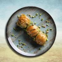 Baklava Boom · Layers of filo pastry drizzled with syrup and garnished with chopped nuts.