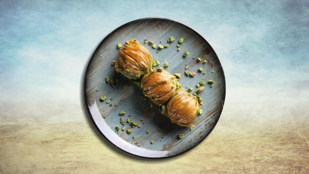 Baklava Boom · Layers of filo pastry drizzled with syrup and garnished with chopped nuts.