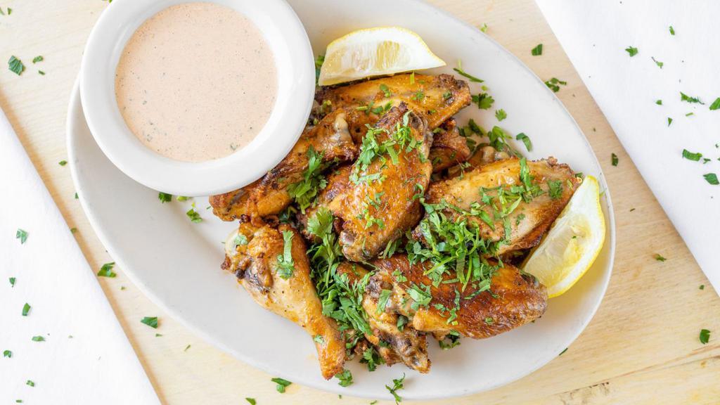 FLAME ROASTED LEMON CHICKEN WINGS · marinated in our special blend of spices and roasted in our brick ovens. (choice of mild, spicy or atomic. served with a choice of creamy ranch, blue cheese or spicy buffalo ranch dressing.)