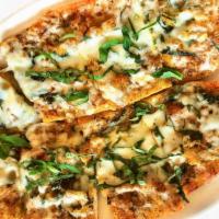 CHEESY GARLIC BREAD · House-made bread topped with garlic butter and melted mozzarella. A delicious appetizer,