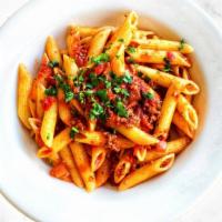 PENNE BOLOGNESE · Penne pasta with a delicious house-made meat sauce.