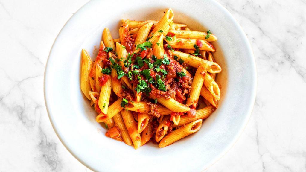 PENNE BOLOGNESE · Penne pasta with a delicious house-made meat sauce.