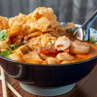 Yen Ta Foh ** · Medium Spicy. Flat rice noodles, calamari, shrimps, fish balls, tofu, spinach, green onions,...