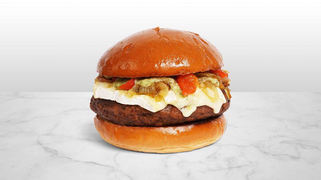 The Italian Burger · Beef patty with roasted red peppers, caramelized onions, melted mozzarella cheese, and a pesto spicy mayo on a fluffy brioche bun.