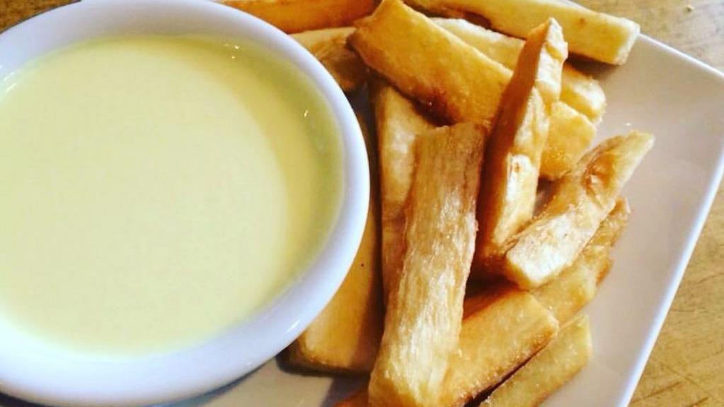 Yucca a La Huancaina · Fried cassava. Served with a slightly spicy cheese sauce on the side.