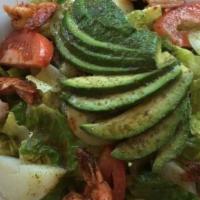 Ensalada Mixta · Romaine lettuce, avocado, celery, onions, tomatoes and cucumber with a vinaigrette.