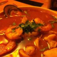 Parihuela · Shrimp, squid, clams and mussels in a soup mixed with light tomato sauce and white wine.