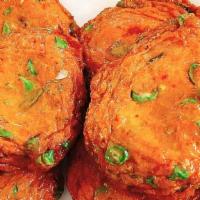 A3. Thai Fish Cake · Fish cake patties seasoned with curry paste, kaffir lime leaves and green bean served with s...